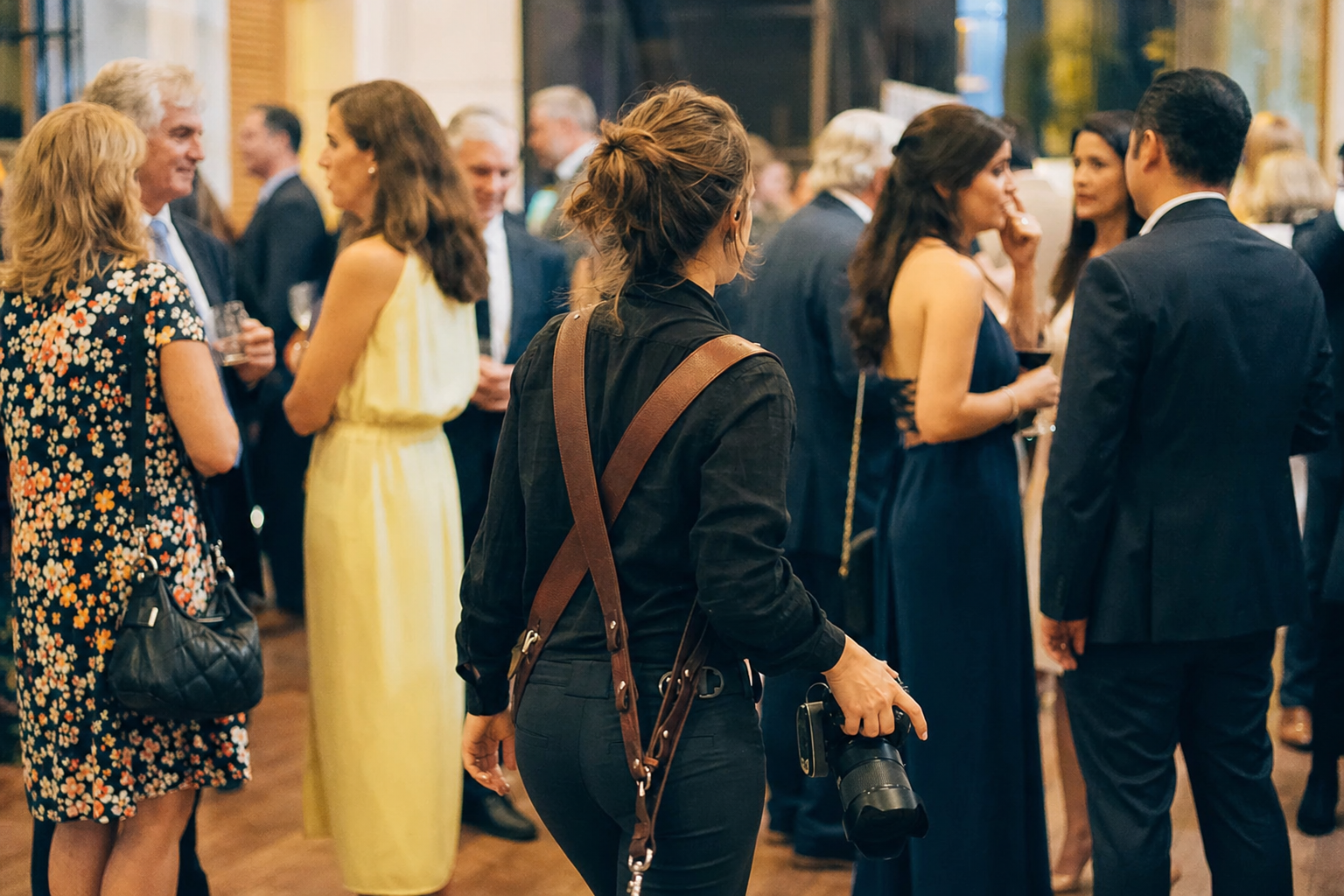 Photographer blending into a crowd at an event to capture candid moments